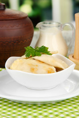 Tasty dumplings with fried onion