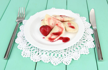 Tasty  sweet dumplings with fresh strawberry