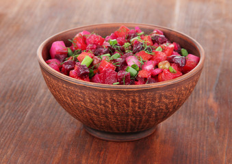Beet salad in bowl on table close-up