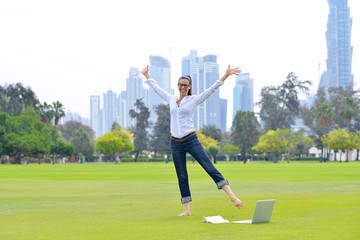 Fototapeta premium woman with laptop in park