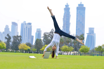 Fototapeta premium woman with laptop in park