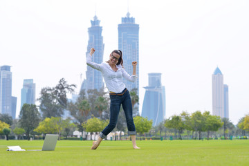Fototapeta premium woman with laptop in park
