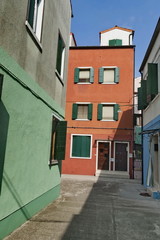 Fototapeta na wymiar A narrow street in Burano island, Italy