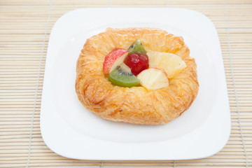 Coffee cup and croissant