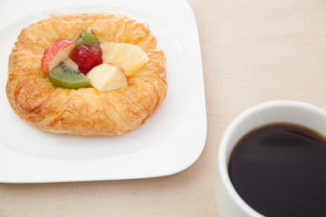 Coffee cup and croissant