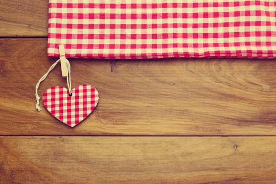 Retro toned background with checked tablecloth and heart shape
