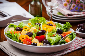 Vegetable salad with olives and cheese
