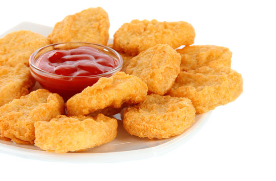 Fried chicken nuggets and sauce isolated on white