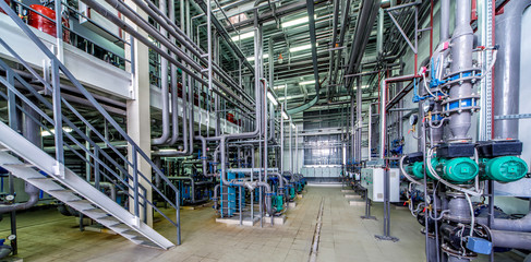 interior gas boiler room with multiple pipelines