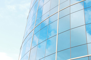 Fototapeta na wymiar background of blue sky reflect on glasses from business buildin