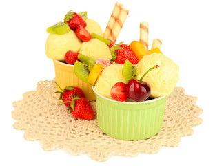 Delicious  ice cream with fruits and berries in bowl isolated