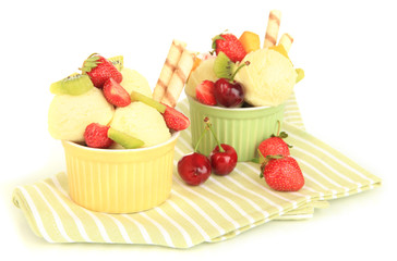 Delicious  ice cream with fruits and berries in bowl isolated