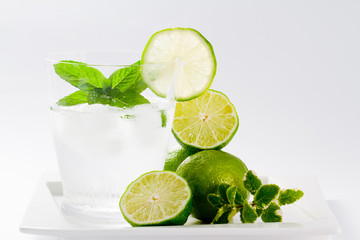 Fototapeta na wymiar Limes, refreshing drink with ice