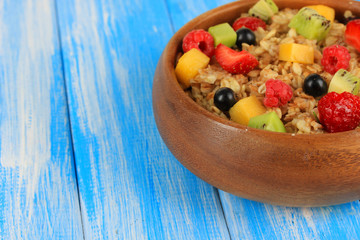 Oatmeal with fruits on table close-up