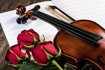 Fototapeta premium Violin, rose and music books