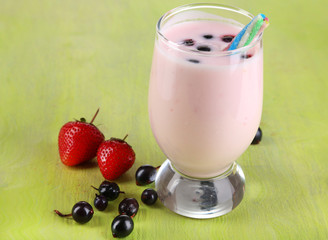 Delicious milk shake with blackberry and strawberries