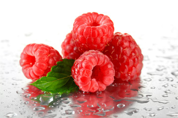 Ripe sweet raspberries with drops, close up