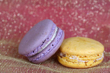 Macaroons on fabric background