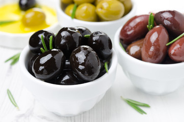 black olives in a bowl close-up, horizontal