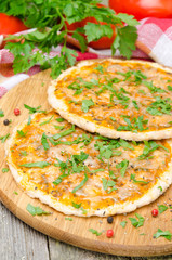 chicken pizza with tomato sauce, cheese and parsley