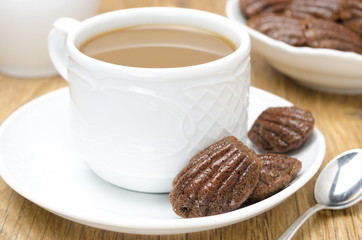 chocolate cookies madeleine and coffee with milk, horizontal
