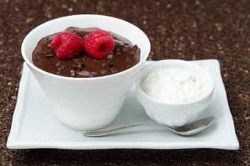 chocolate mousse with fresh raspberries and whipped cream