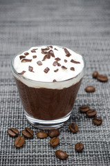 chocolate-coffee mousse with whipped cream in glass