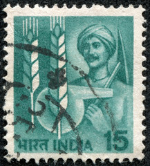 stamp printed in India shows peasant