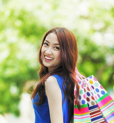 Smiling girl with shopping bags