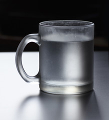 a cup of water, centered, stylized