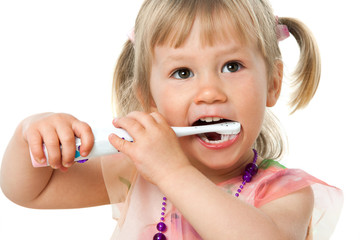 Close up portrait of cute girl brushing teeth.
