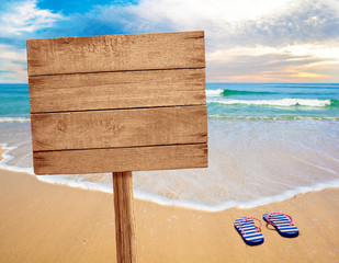 wood sign on beach © Andrey Kuzmin