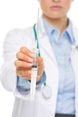 Closeup on doctor woman giving syringe