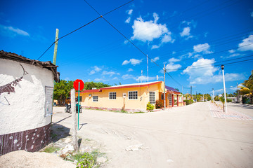 Fototapeta na wymiar Sandy street in an exotic country on the Mexican island