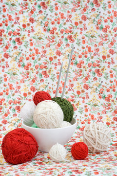 A lot of bright balls of knitting on the background