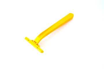 Yellow shaver on white background