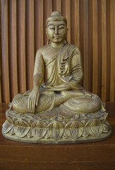 wooden budha on table