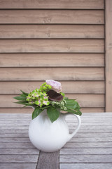 Flower bouquet on wooden table