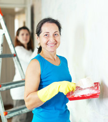  women  making repairs at home