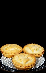 Mince pies against black background © Arena Photo UK