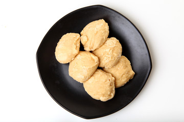 Brown sugar in a black dish