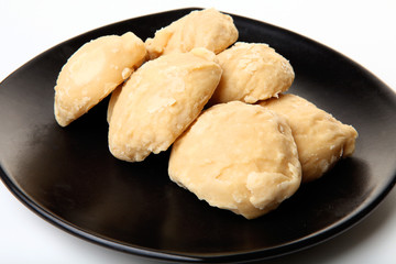 Brown sugar in a black dish