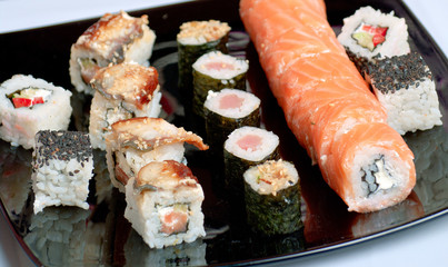 sushi on black plate