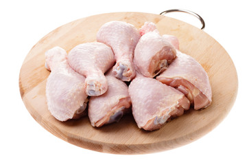 raw chicken legs on wood