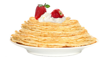 sweet pancakes with strawberry and cream isolated