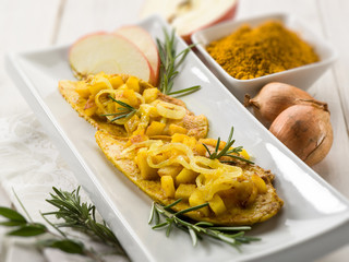 escalope with apple onions and curry, selective focus
