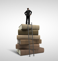 businessman standing on books
