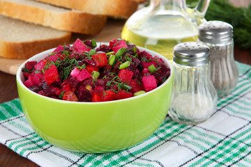 Beet salad in bowl on table close-up