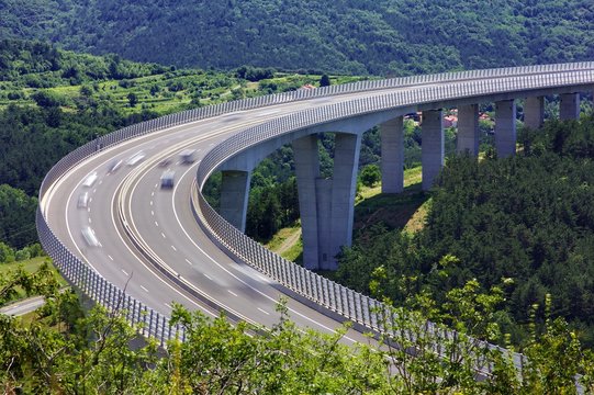 Fototapeta Fast traffic on the bridge of a slovenian highway