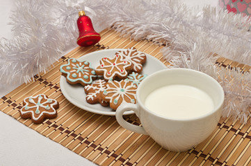 Obraz na płótnie Canvas Decorated Sugar Cookies and Milk for Santa at Christmas Time